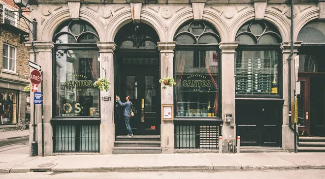 urban, montreal, downtown, streetscape, road, building, architecture, bar, restaurant, historic building, storefront, store, montreal, montreal, bar, restaurant, restaurant, restaurant, restaurant, restaurant, storefront, storefront, store, store. How Montreal plateau lots and French-language permits shape a studio build