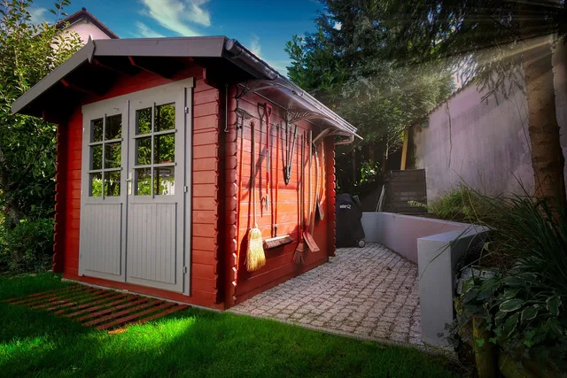 garden shed, garden, sunlight, building, door, entrance door, cottage, nature, architecture, paving stones, sunshine, grass, lawn, plants. Which prefab studio shed options only make sense at the factory